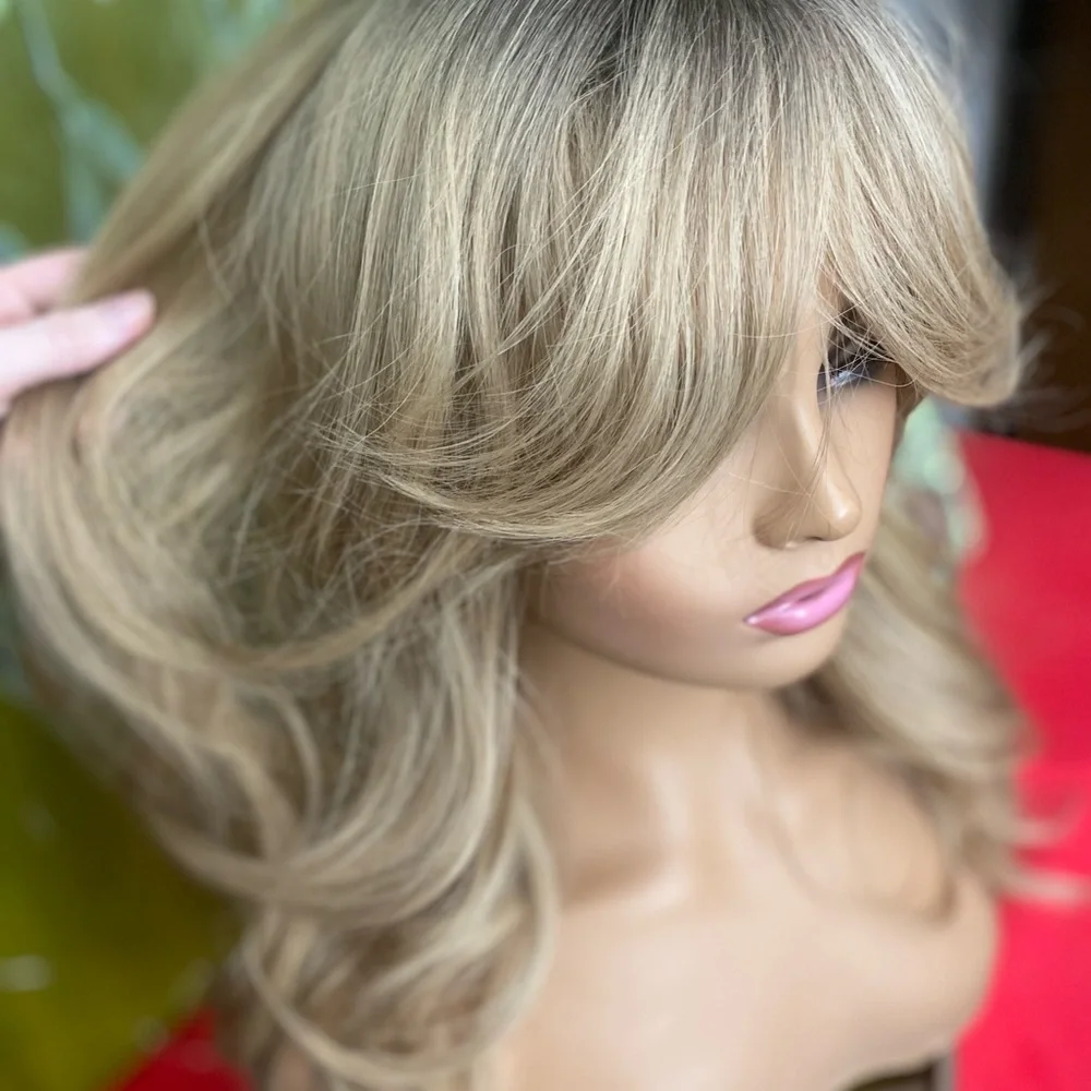 Golden dirty blonde layered wig with bangs and roots